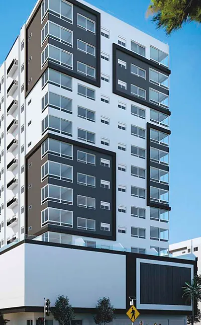 Fachada do Edifício Ilha Saona, branca com molduras em cinza escuro, na esquina
